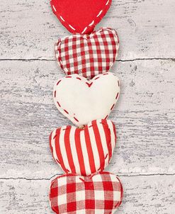 Five Red and White Fabric Hearts