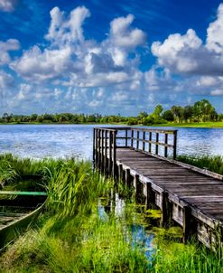 Rowboat at the Dock Under Clouds