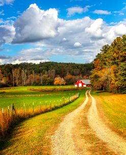 The Red Barn Under the Clouds