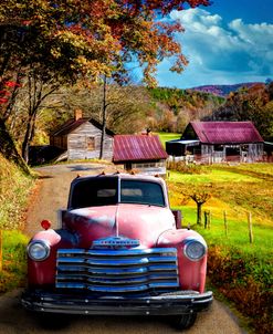 Red Truck in Autumn Colors at the Barns