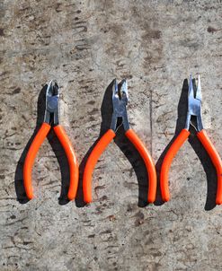 Three Orange Handled Pliers