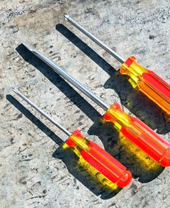 Three Red And Yellow Screwdrivers