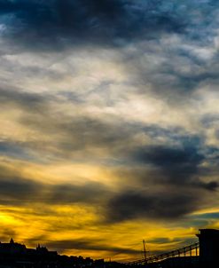 Cityscape Silhouette Under Clouds