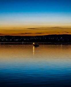 Fishing Boat on Lake at Sunset
