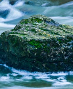 Giant Moss Covered Boulder Swirling Water