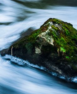 Moss Covered Rock Slow Swirling Water