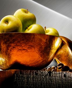 Apple In A Gold Bowl