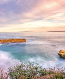 Rock And Seawall Sunrise