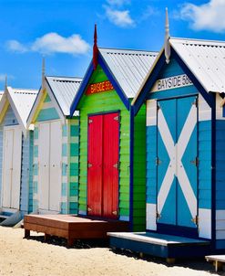 Beach Huts under blue skies