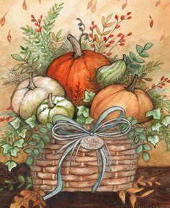 Pumpkins In Basket With Leaves In Autumn