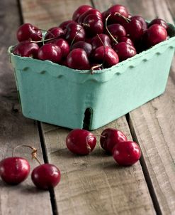 Red Cherries on Wood