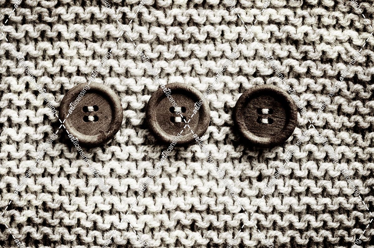 Row Of 3 Old Buttons On Wool