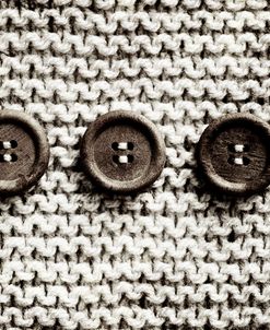 Row Of 3 Old Buttons On Wool