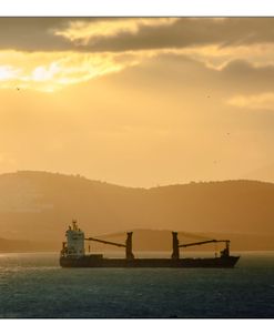Cargo Ship In The Sunset
